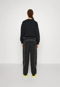 The North Face Piping Wind Pant - Tracksuit Bottoms -The North Face 33d04a239ba147f58bd9b60f9a409da1