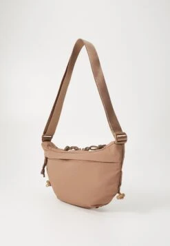 The North Face NEVER STOP CROSSBODY UNISEX - Cross Body Bag - Latte -The North Face 346569a3765a47dca3c7afcc3cb8b73b