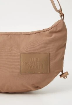 The North Face NEVER STOP CROSSBODY UNISEX - Cross Body Bag - Latte -The North Face 5add0c7ac89b4b6ea153634baf447ff6