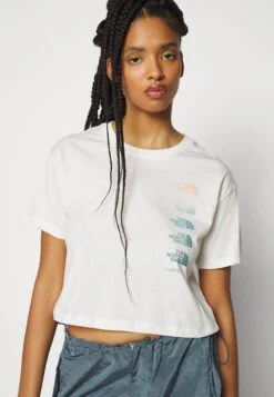 The North Face Graphic Crop Tee - Print T-Shirt - Gardenia White 15 The North Face Graphic Crop Tee - Print T-Shirt - Gardenia White -The North Face a0e00a4a899741bbbc40f100e85f8c5f