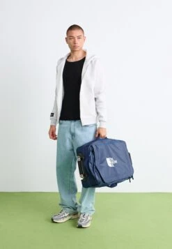 The North Face BASE CAMP VOYAGER 21 ROLLER UNISEX - Wheeled Suitcase - Shady Blue/summit Navy -The North Face af7c955ba8164aafa19993346edf3964