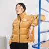 The North Face Reversible Nuptse Jacket - Down Jacket - Almond Butter/Coal Brown